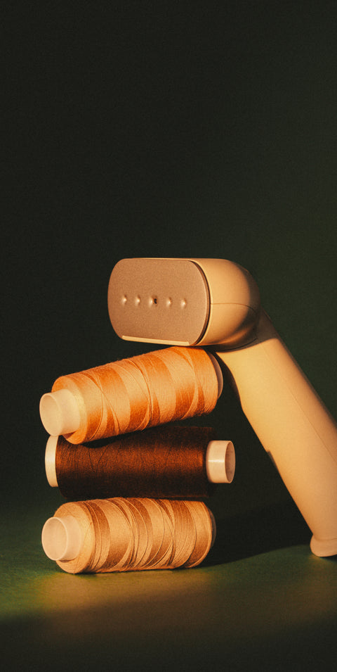 steamer leaning on thread spools