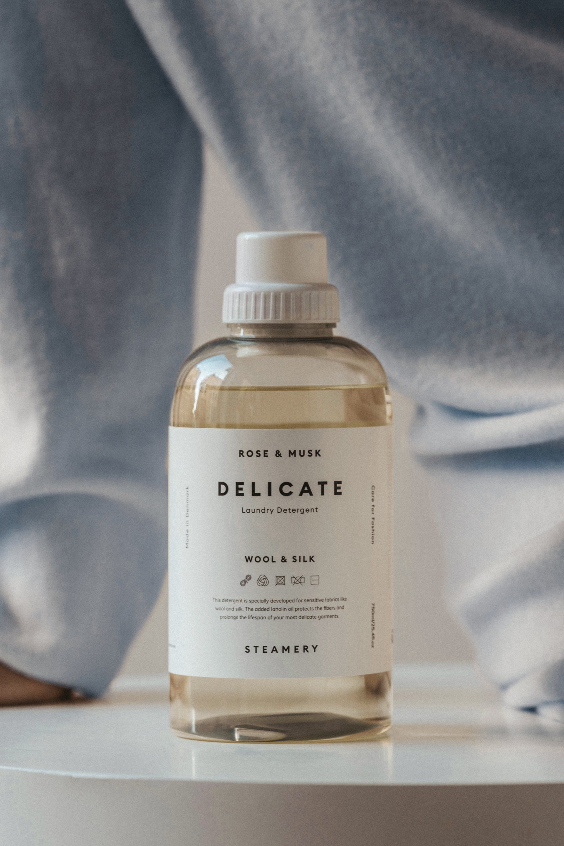 detergent with someone wearing cashmere behind it