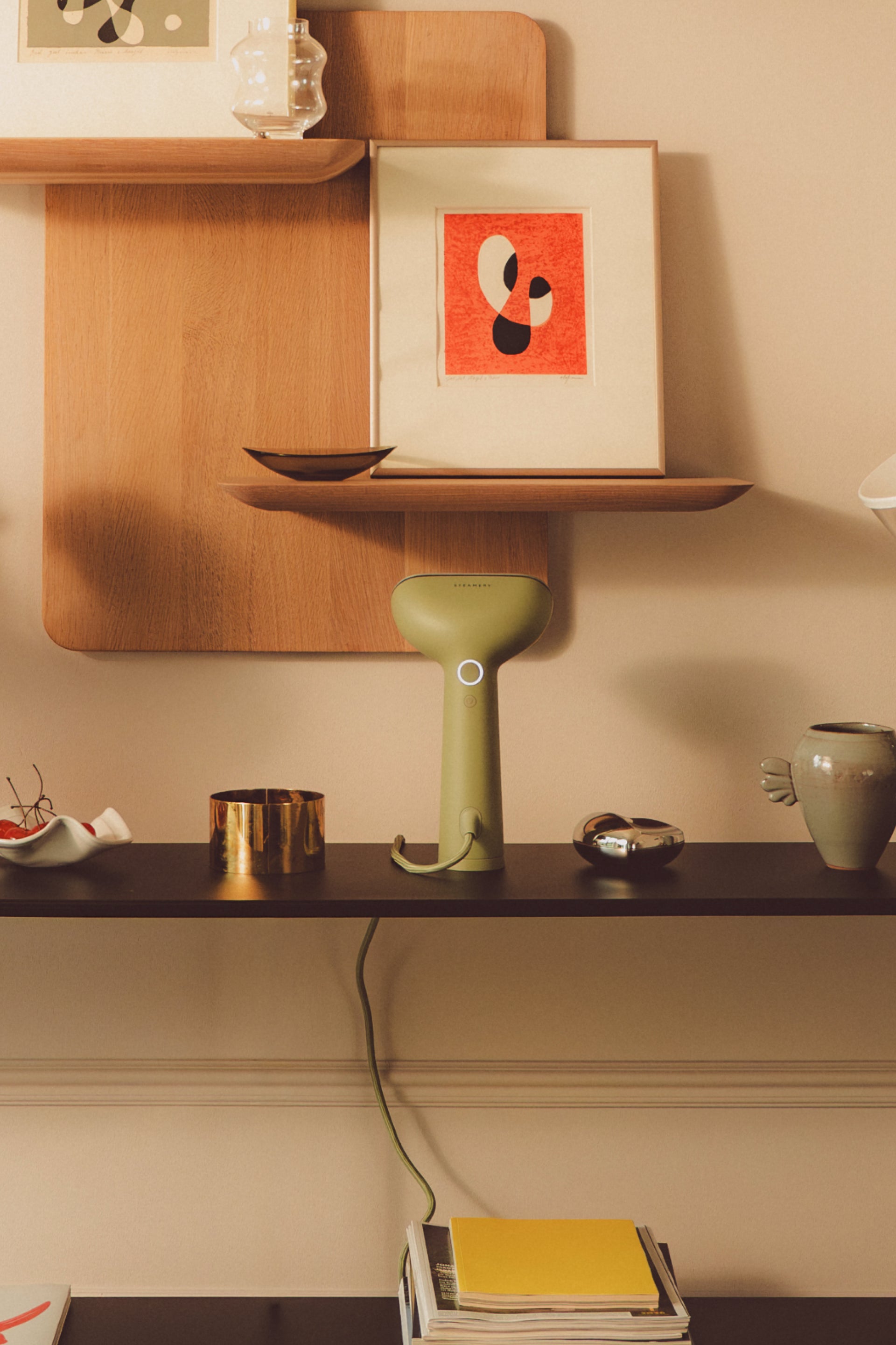 Green steamer on a shelf