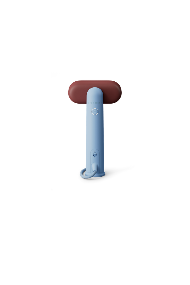 Blue handheld steamer on a white background