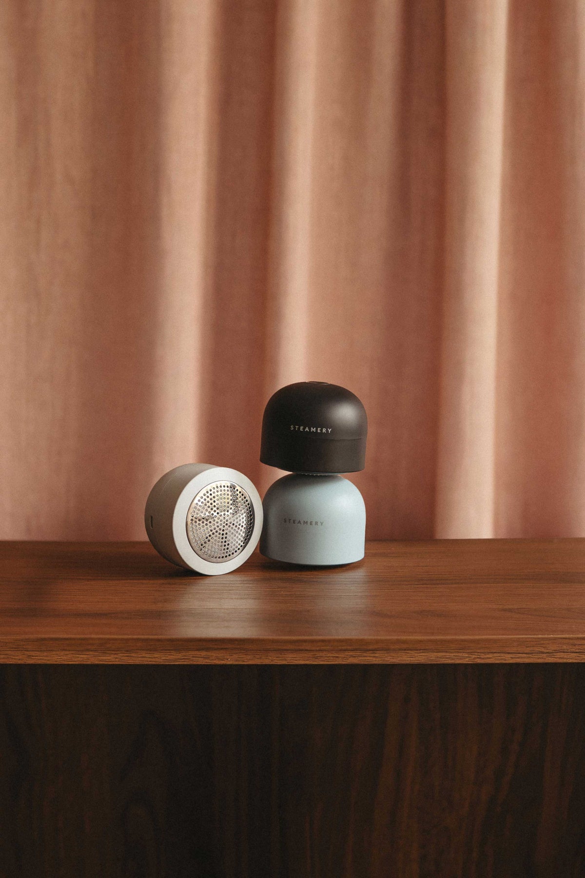 3 colored fabric shavers on a table