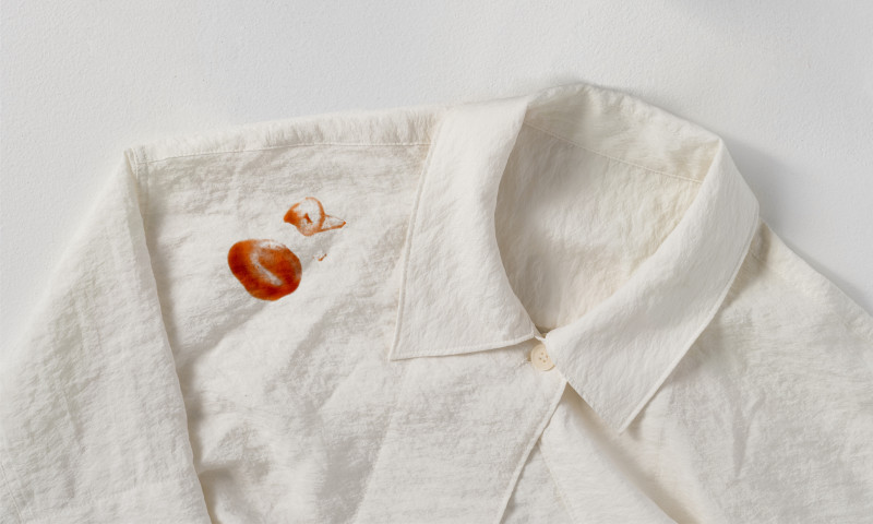 Tomato sauce stain on white fabric