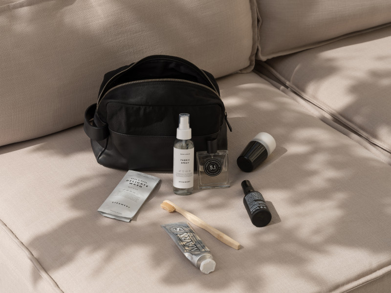 A toiletry bag with small travel accessories